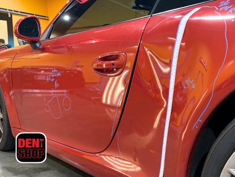 car dent getting repaired at dent shop